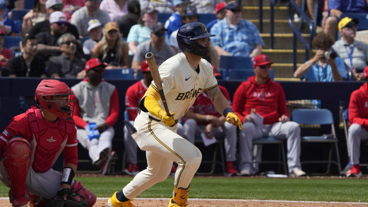 Mar 18, 2024; Phoenix, Arizona, USA; Milwaukee Brewers center fielder Garrett Mitchell (5) hits a single against the Los Angeles Angels in the second inning at American Family Fields of Phoenix.