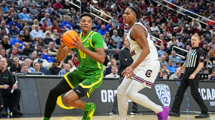 Mar 21, 2024; Pittsburgh, PA, USA; Oregon Ducks forward Kwame Evans Jr. (10) drives to the basket against South Carolina Gamecocks forward Collin Murray-Boyles (30) during the second half in the first round of the 2024 NCAA Tournament at PPG Paints Arena. Mandatory Credit: Gregory Fisher-USA TODAY Sports Mar 21, 2024; Pittsburgh, PA, USA; Oregon Ducks forward Kwame Evans Jr. (10) drives to the basket against South Carolina Gamecocks forward Collin Murray-Boyles (30) during the second half in the first round of the 2024 NCAA Tournament at PPG Paints Arena. Mandatory Credit: Gregory Fisher-USA TODAY Sports