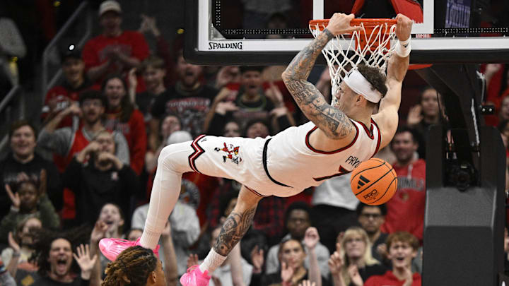 Nov 6, 2025; Louisville, Kentucky, USA; Louisville Cardinals forward Kasean Pryor (7) dunks against Jackson State Tigers forward Jayme Mitchell Jr. (3) during the first half at KFC Yum! Center. Mandatory Credit: Jamie Rhodes-Imagn Images Nov 6, 2025; Louisville, Kentucky, USA; Louisville Cardinals forward Kasean Pryor (7) dunks against Jackson State Tigers forward Jayme Mitchell Jr. (3) during the first half at KFC Yum! Center. Mandatory Credit: Jamie Rhodes-Imagn Images