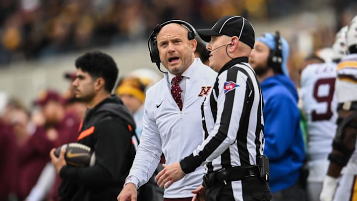 Oct 25, 2025; Iowa City, Iowa, USA; Minnesota Golden Gophers head coach P.J. Fleck reacts near a referee during the first quarter against the Iowa Hawkeyes at Kinnick Stadium. Mandatory Credit: Jeffrey Becker-Imagn Images Oct 25, 2025; Iowa City, Iowa, USA; Minnesota Golden Gophers head coach P.J. Fleck reacts near a referee during the first quarter against the Iowa Hawkeyes at Kinnick Stadium. Mandatory Credit: Jeffrey Becker-Imagn Images