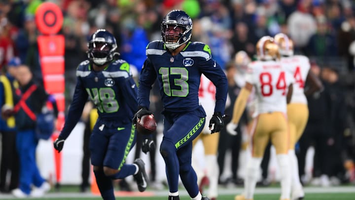 Jan 17, 2026; Seattle, WA, USA; Seattle Seahawks linebacker Ernest Jones IV (13) reacts after an interception against the San Francisco 49ers during the second half in an NFC Divisional Round game at Lumen Field. Mandatory Credit: Steven Bisig-Imagn Images