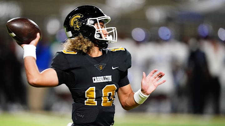Oct 20, 2023; Carrollton, GA, USA; Carrollton Trojans quarterback Julian Lewis (10) drops back to pass against the Westlake Lions during the first half at Grisham Stadium. The 15-year-old Carrollton High student has already committed to playing for the University of Southern California Trojans and has been considered one of the top high school quarterback prospects. Mandatory Credit: John David Mercer-Imagn Images