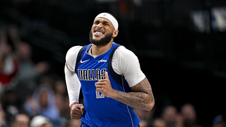 Dallas Mavericks center Daniel Gafford grimaces as he runs back up the court during the second half against the Brooklyn Nets