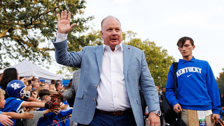 Oct 12, 2024; Lexington, Kentucky, USA; Kentucky Wildcats head coach Mark Stoops greets fans at Cat Walk before the game against the Vanderbilt Commodores at Kroger Field. Mandatory Credit: Jordan Prather-Imagn Images