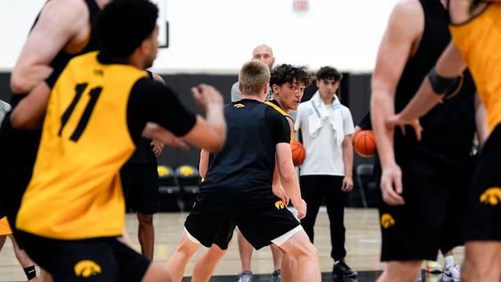 Iowa’s Isaia Howard (23) handles the ball as Bennett Stirtz (14) defends during practice June 19, 2025 at Carver-Hawkeye Arena in Iowa City, Iowa.