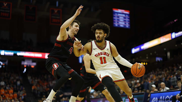 Jan 10, 2026; Charlottesville, Virginia, USA; Virginia Cavaliers forward Devin Tillis (11) drives to the basket as Stanford Cardinal forward AJ Rohosy (4) defends in the second half at John Paul Jones Arena. Mandatory Credit: Geoff Burke-Imagn Images