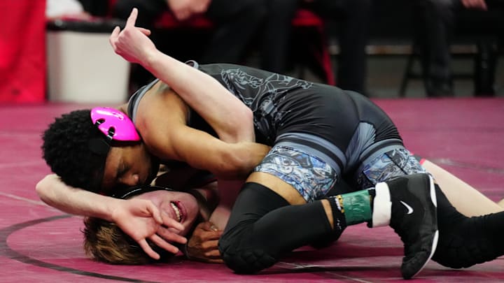Kenosha St. Joseph's Co'Ji Campbell, top, competes in the Division 3 120-pound championship match during the WIAA state individual wrestling tournament on Saturday, Feb. 24, 2024, at the Kohl Center in Madison, Wis.