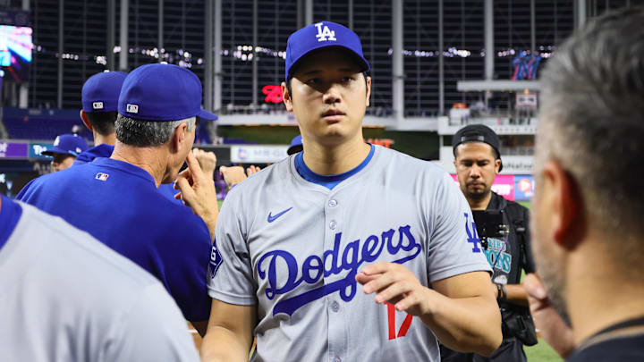Sep 19, 2024; Miami, Florida, USA; Los Angeles Dodgers designated hitter Shohei Ohtani (17) celebrates with teammates after the game against the Miami Marlins at loanDepot Park. Mandatory Credit: Sam Navarro-Imagn Images