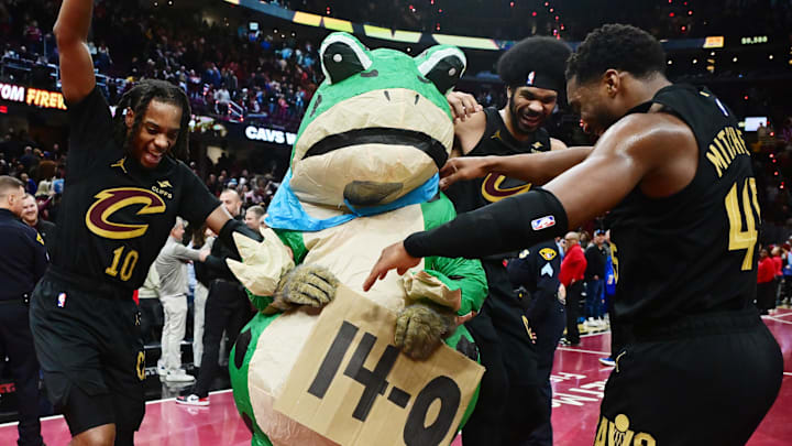 Nov 15, 2024; Cleveland, Ohio, USA; Cleveland Cavaliers guard Darius Garland (10) and center Jarrett Allen (31) and guard Donovan Mitchell (45) celebrate with Moondog after the Cavs defeated the Chicago Bulls and moved to 14-0 on the season at Rocket Mortgage FieldHouse. Mandatory Credit: Ken Blaze-Imagn Images