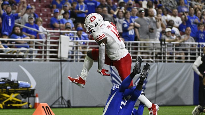 Jun 8, 2025; St. Louis, MO, USA; DC Defenders wide receiver Cornell Powell (14) leaps over St. Louis Battlehawks cornerback Myles Jones (24) during the third quarter at The Dome at America’s Center. Mandatory Credit: Jeff Le-Imagn Images Jun 8, 2025; St. Louis, MO, USA; DC Defenders wide receiver Cornell Powell (14) leaps over St. Louis Battlehawks cornerback Myles Jones (24) during the third quarter at The Dome at America’s Center. Mandatory Credit: Jeff Le-Imagn Images