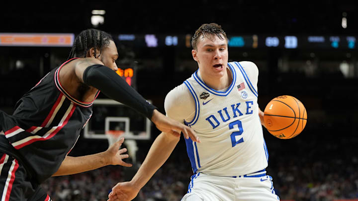 Duke Blue Devils forward Cooper Flagg controls the ball against Houston Cougars forward J'Wan Roberts. Duke Blue Devils forward Cooper Flagg controls the ball against Houston Cougars forward J'Wan Roberts.