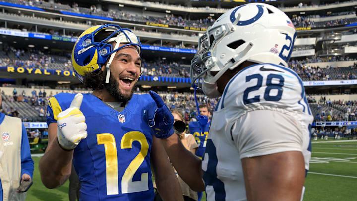 Sep 28, 2025; Inglewood, California, USA; Los Angeles Rams wide receiver Puka Nacua (12) and Indianapolis Colts running back Jonathan Taylor (28) on the field after the game at SoFi Stadium. Mandatory Credit: Jayne Kamin-Oncea-Imagn Images