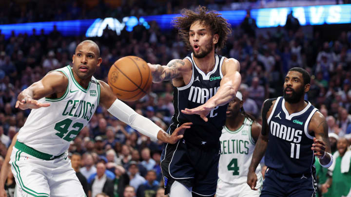 Jun 12, 2024; Dallas, Texas, USA; Dallas Mavericks center Dereck Lively II (2) passes the ball against Boston Celtics center Al Horford (42) during the fourth quarter during game three of the 2024 NBA Finals at American Airlines Center. Mandatory Credit: Kevin Jairaj-USA TODAY Sports Jun 12, 2024; Dallas, Texas, USA; Dallas Mavericks center Dereck Lively II (2) passes the ball against Boston Celtics center Al Horford (42) during the fourth quarter during game three of the 2024 NBA Finals at American Airlines Center. Mandatory Credit: Kevin Jairaj-USA TODAY Sports