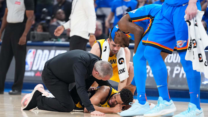 Jun 22, 2025; Oklahoma City, Oklahoma, USA; Indiana Pacers guard Tyrese Haliburton (0) reacts after suffering an injury during the first quarter against the Oklahoma City Thunder during game seven of the 2025 NBA Finals at Paycom Center. Mandatory Credit: Kyle Terada-Imagn Images Jun 22, 2025; Oklahoma City, Oklahoma, USA; Indiana Pacers guard Tyrese Haliburton (0) reacts after suffering an injury during the first quarter against the Oklahoma City Thunder during game seven of the 2025 NBA Finals at Paycom Center. Mandatory Credit: Kyle Terada-Imagn Images