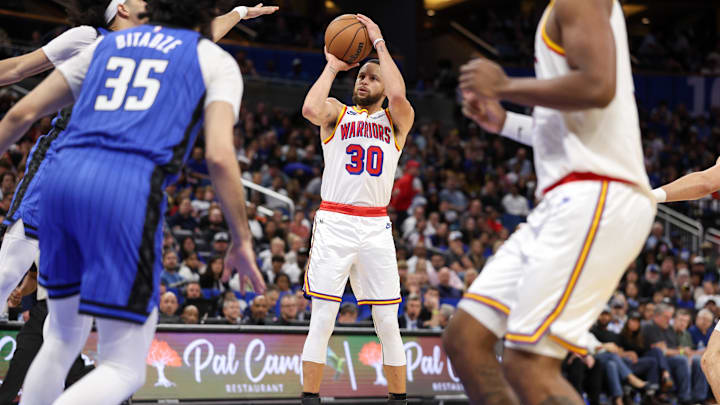 Golden State Warriors guard Stephen Curry (30) shoots the ball against the Orlando Magic in the third quarter at Kia Center. Golden State Warriors guard Stephen Curry (30) shoots the ball against the Orlando Magic in the third quarter at Kia Center.