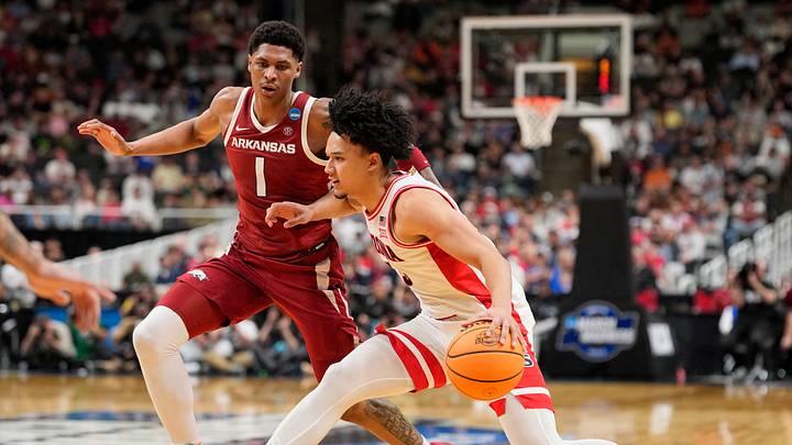 Mar 26, 2026; San Jose, CA, USA; Arizona Wildcats guard Brayden Burries (5) dribbles the ball against Arkansas Razorbacks guard Meleek Thomas (1) in the second half during a Sweet Sixteen game of the West Regional of the men's 2026 NCAA Tournament at SAP Center. Mandatory Credit: Kyle Terada-Imagn Images