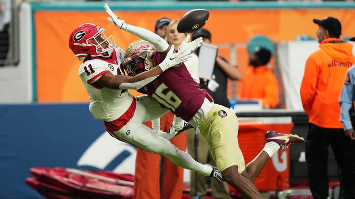 Dec 30, 2023; Miami Gardens, FL, USA; Georgia Bulldogs wide receiver Arian Smith (11) attempts to make a catch over Florida State Seminoles defensive back Quindarrius Jones (16) during the first half in the 2023 Orange Bowl at Hard Rock Stadium. Mandatory Credit: Jasen Vinlove-USA TODAY Sports Dec 30, 2023; Miami Gardens, FL, USA; Georgia Bulldogs wide receiver Arian Smith (11) attempts to make a catch over Florida State Seminoles defensive back Quindarrius Jones (16) during the first half in the 2023 Orange Bowl at Hard Rock Stadium. Mandatory Credit: Jasen Vinlove-USA TODAY Sports