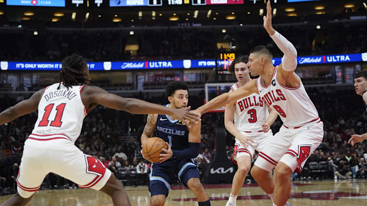 Memphis Grizzlies guard Scotty Pippen Jr. (1) is defended by Chicago Bulls guard Ayo Dosunmu (11) during the first half at United Center. 