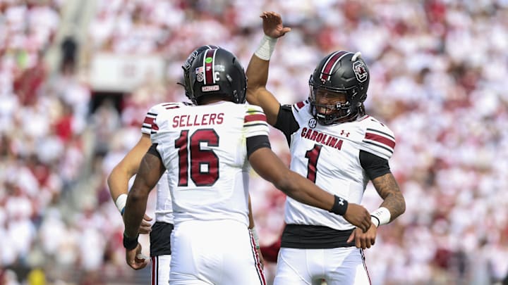 Oct 19, 2024; Norman, Oklahoma, USA; South Carolina Gamecocks quarterback LaNorris Sellers (16) celebrates with South Carolina Gamecocks quarterback Robby Ashford (1) after a touchdown against the Oklahoma Sooners during the first half at Gaylord Family-Oklahoma Memorial Stadium. Oct 19, 2024; Norman, Oklahoma, USA; South Carolina Gamecocks quarterback LaNorris Sellers (16) celebrates with South Carolina Gamecocks quarterback Robby Ashford (1) after a touchdown against the Oklahoma Sooners during the first half at Gaylord Family-Oklahoma Memorial Stadium.