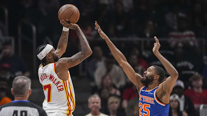 Apr 25, 2026; Atlanta, Georgia, USA; Atlanta Hawks guard Nickeil Alexander-Walker (7) shoots over New York Knicks guard Mikal Bridges (25) during the first half at State Farm Arena. Mandatory Credit: Dale Zanine-Imagn Images