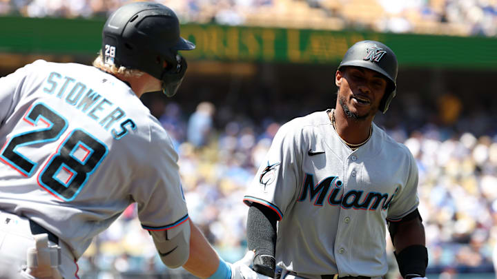 Miami Marlins left fielder Esteury Ruiz (right) is congratulated by designated hitter Kyle Stowers.