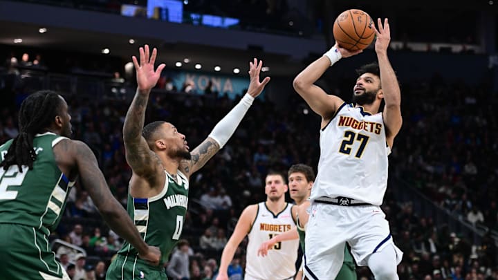 Feb 27, 2025; Milwaukee, Wisconsin, USA; Denver Nuggets guard Jamal Murray (27) takes a shot against Milwaukee Bucks guard Damian Lillard (0) in the third quarter at Fiserv Forum. Mandatory Credit: Benny Sieu-Imagn Images Feb 27, 2025; Milwaukee, Wisconsin, USA; Denver Nuggets guard Jamal Murray (27) takes a shot against Milwaukee Bucks guard Damian Lillard (0) in the third quarter at Fiserv Forum. Mandatory Credit: Benny Sieu-Imagn Images