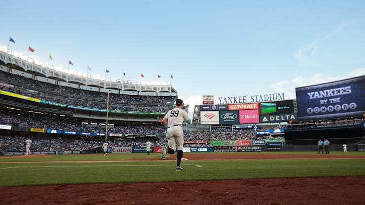 Jun 6, 2024; Bronx, New York, USA;  New York Yankees center fielder Aaron Judge (99) runs on to the field before the third inning against the Minnesota Twins at Yankee Stadium. Mandatory Credit: Vincent Carchietta-Imagn Images