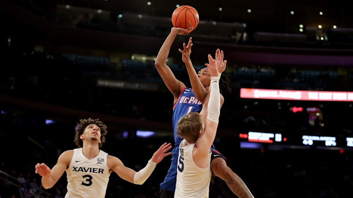 Mar 9, 2023; New York, NY, USA; DePaul Blue Demons forward Javan Johnson (1) takes a shot against Xavier Musketeers guards Adam Kunkel (5) and Colby Jones (3) during the first half at Madison Square Garden. Mandatory Credit: Brad Penner-Imagn Images