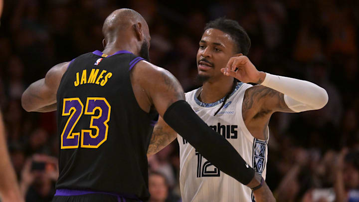 Jan 2, 2026; Los Angeles, California, USA; Los Angeles Lakers forward LeBron James (23) and Memphis Grizzlies guard Ja Morant (12) embrace following the game at Crypto.com Arena. Mandatory Credit: Jayne Kamin-Oncea-Imagn Images Jan 2, 2026; Los Angeles, California, USA; Los Angeles Lakers forward LeBron James (23) and Memphis Grizzlies guard Ja Morant (12) embrace following the game at Crypto.com Arena. Mandatory Credit: Jayne Kamin-Oncea-Imagn Images
