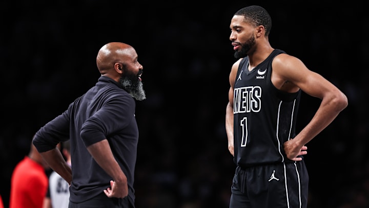Mikal Bridges consulting with Head Coach Jacque Vaughn