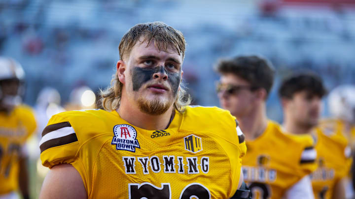 Dec 30, 2022; Tucson, AZ, USA; Wyoming Cowboys offensive tackle Caden Barnett (72) against the Ohio Bobcats during the 2022 Barstool Sports Arizona Bowl at Arizona Stadium. Mandatory Credit: Mark J. Rebilas-Imagn Images