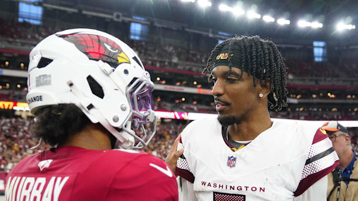 Washington quarterback Jayden Daniels hugs Cardinals quarterback Kyler Murray (1) after a Cardinals loss during a game at State Farm Stadium in Glendale on Sept. 29, 2024.
