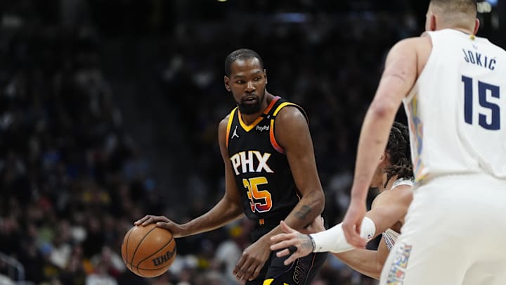 Mar 7, 2025; Denver, Colorado, USA; Phoenix Suns forward Kevin Durant (35) controls the ball in the first quarter against the Denver Nuggets at Ball Arena. Mandatory Credit: Ron Chenoy-Imagn Images