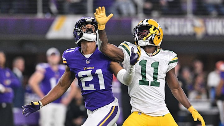 Dec 31, 2023; Minneapolis, Minnesota, USA; Minnesota Vikings cornerback Akayleb Evans (21) and Green Bay Packers wide receiver Jayden Reed (11) in action during the game at U.S. Bank Stadium. Mandatory Credit: Jeffrey Becker-Imagn Images Dec 31, 2023; Minneapolis, Minnesota, USA; Minnesota Vikings cornerback Akayleb Evans (21) and Green Bay Packers wide receiver Jayden Reed (11) in action during the game at U.S. Bank Stadium. Mandatory Credit: Jeffrey Becker-Imagn Images