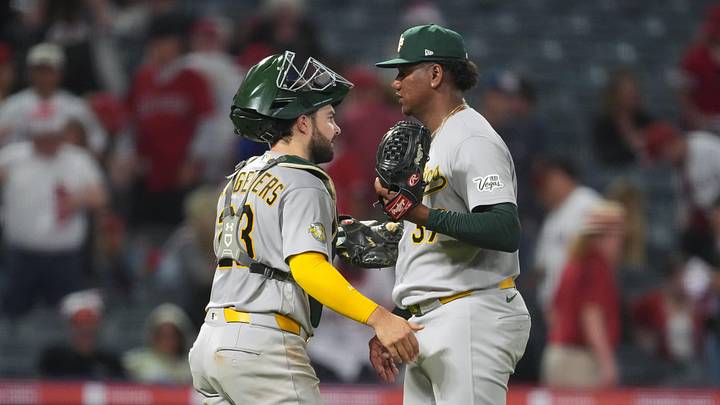 Jun 26, 2026; Anaheim, California, USA; Athletics catcher Shea Langeliers (23) and pitcher Elvis Alvarado (37) embrace after the game against the Los Angeles Angels at Angel Stadium. Mandatory Credit: Kirby Lee-Imagn Images