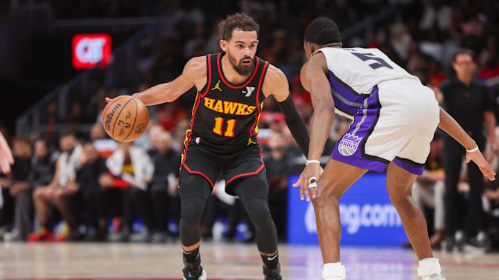 Nov 1, 2024; Atlanta, Georgia, USA; Atlanta Hawks guard Trae Young (11) is defended by Sacramento Kings guard De'Aaron Fox (5) in the fourth quarter at State Farm Arena. Mandatory Credit: Brett Davis-Imagn Images
