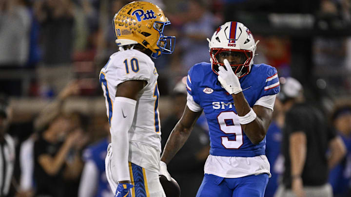Nov 2, 2024; Dallas, Texas, USA; Southern Methodist Mustangs wide receiver Key'Shawn Smith (9) celebrates after he makes against Pittsburgh Panthers defensive back Ryland Gandy (10) during the second half at Gerald J. Ford Stadium. Mandatory Credit: Jerome Miron-Imagn Images