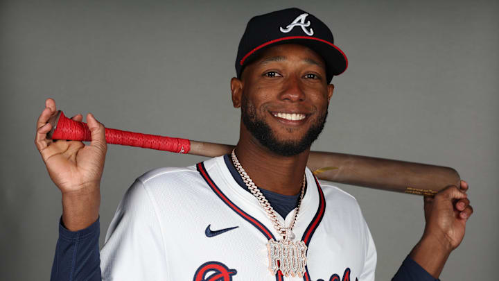 Feb 21, 2025; North Port, FL, USA; Atlanta Braves outfielder Jurickson Profar (7) takes photos during media day CoolToday Park. Mandatory Credit: Kim Klement Neitzel-Imagn Images