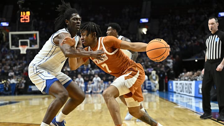 Texas Longhorns guard Simeon Wilcher drives against BYU Cougars forward Khadim Mboup in the first half during a first-round game of the men's 2026 NCAA Tournament at Moda Center. Texas Longhorns guard Simeon Wilcher drives against BYU Cougars forward Khadim Mboup in the first half during a first-round game of the men's 2026 NCAA Tournament at Moda Center.