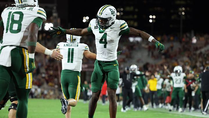 Oct 3, 2026; Tempe, Arizona, USA; Baylor Bears wide receiver Louis Brown IV (4) celebrates after Baylor Bears running back Caden Knighten (11) scores a touchdown against the Arizona State Sun Devils during the third quarter at Mountain America Stadium. Mandatory Credit: Anna Carrington-Imagn Images Oct 3, 2026; Tempe, Arizona, USA; Baylor Bears wide receiver Louis Brown IV (4) celebrates after Baylor Bears running back Caden Knighten (11) scores a touchdown against the Arizona State Sun Devils during the third quarter at Mountain America Stadium. Mandatory Credit: Anna Carrington-Imagn Images