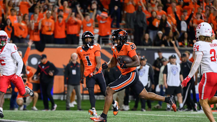Sep 26, 2025; Corvallis, Oregon, USA; Oregon State Beavers running back Cornell Hatcher Jr. (21) runs the ball for a touchdown during the second half against the Houston Cougars at Reser Stadium. Mandatory Credit: Craig Strobeck-Imagn Images
