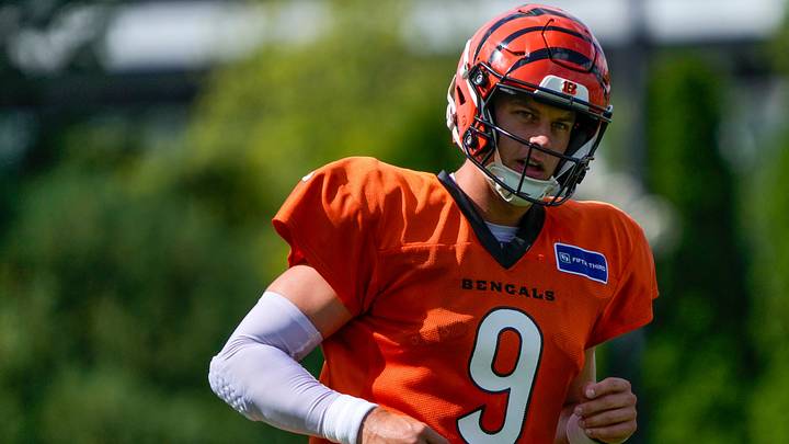 Cincinnati Bengals quarterback Joe Burrow (9) runs a play during practice at the Paycor Stadium practice facility in downtown Cincinnati on Monday, Aug. 3, 2026. Cincinnati Bengals quarterback Joe Burrow (9) runs a play during practice at the Paycor Stadium practice facility in downtown Cincinnati on Monday, Aug. 3, 2026.