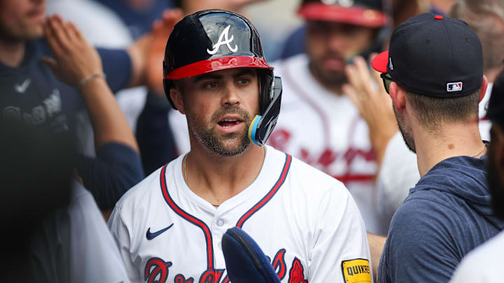 Sep 30, 2024; Atlanta, Georgia, USA; Atlanta Braves left fielder Whit Merrifield (15) celebrates with teammates after scoring a run against the New York Mets in the eighth inning at Truist Park. Mandatory Credit: Brett Davis-Imagn Images
