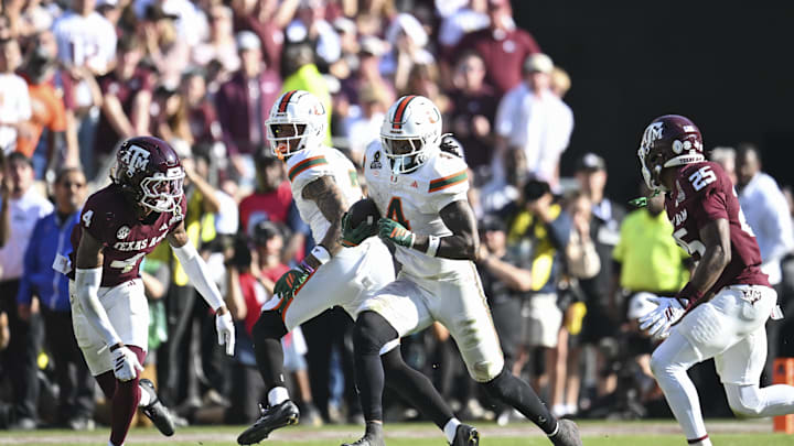 Miami Hurricanes running back Mark Fletcher Jr. (4) runs the ball against Texas A&M Aggies cornerback Will Lee III (4) during the second half of the first round game of the CFP National Playoff at Kyle Field. Mandatory Credit: Maria Lysaker-Imagn Images