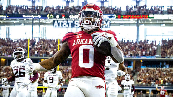 Arkansas running back AJ Green scores a touchdown against Texas A&M in the Southwest Classic at AT&T Stadium in Arlington, Texas. Arkansas running back AJ Green scores a touchdown against Texas A&M in the Southwest Classic at AT&T Stadium in Arlington, Texas.