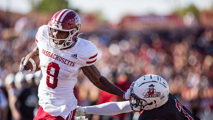 NMSU  s Keynote Glinton reaches for Mass wide receiver Anthony Simpson during an Aggie football game on Saturday, August 256 2023, at the Aggie Memorial Stadium.