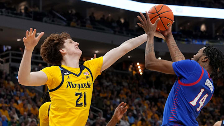 Marquette forward Ben Gold (21) defends DePaul center Nick Ongenda (14) during the second half of