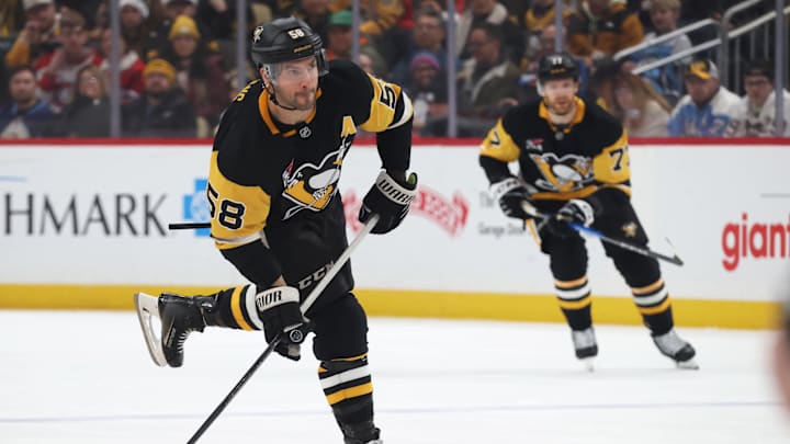 Dec 21, 2025; Pittsburgh, Pennsylvania, USA;  Pittsburgh Penguins defenseman Kris Letang (58) shoots the puck against the Montréal Canadiens during the third period at PPG Paints Arena. Mandatory Credit: Charles LeClaire-Imagn Images