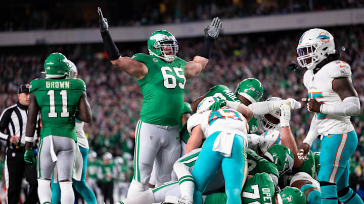 Philadelphia Eagles offensive tackle Lane Johnson (65) reacts after a Jalen Hurts (1) touchdown on a quarterback sneak against the Miami Dolphins during the second quarter at Lincoln Financial Field in the 2023 season. Philadelphia Eagles offensive tackle Lane Johnson (65) reacts after a Jalen Hurts (1) touchdown on a quarterback sneak against the Miami Dolphins during the second quarter at Lincoln Financial Field in the 2023 season.