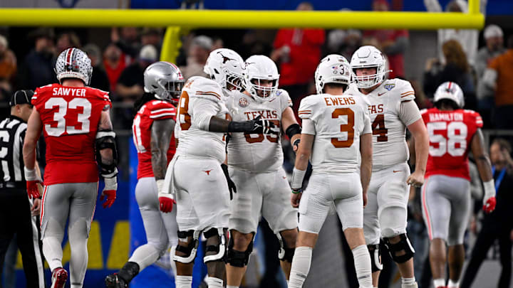 Jan 10, 2025; Arlington, TX, USA; Texas Longhorns offensive lineman Kelvin Banks Jr. (78) and quarterback Quinn Ewers (3) and offensive lineman Cole Hutson (54) and offensive lineman Jake Majors (65) celebrate during the game between the Texas Longhorns and the Ohio State Buckeyes at AT&T Stadium. Mandatory Credit: Jerome Miron-Imagn Images